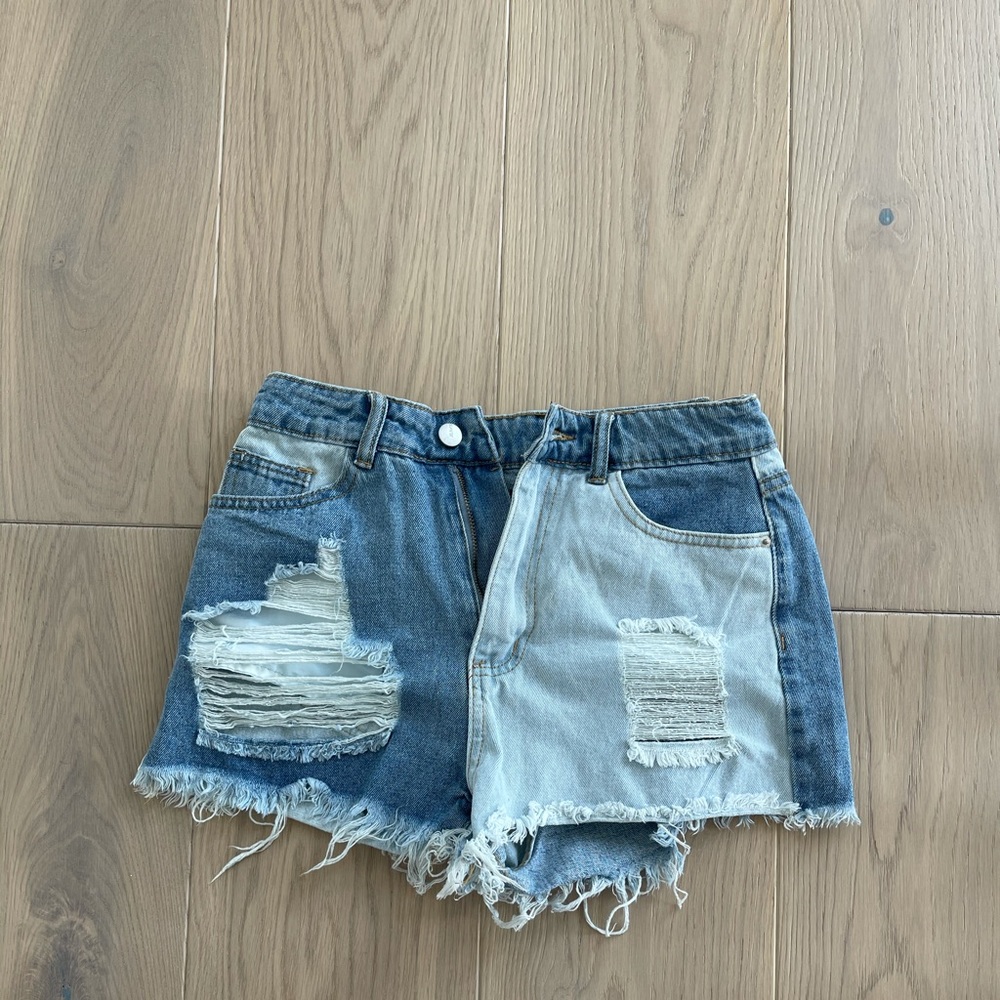 SHEIN Distressed denim shorts.